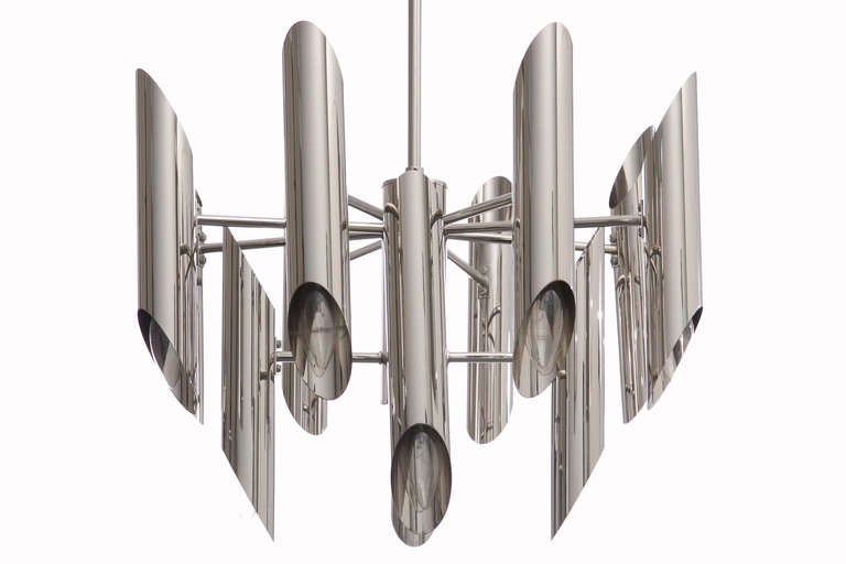 1970s Italian tubular chromed steel chandelier with twelve sockets, chrome rod and ceiling cap.