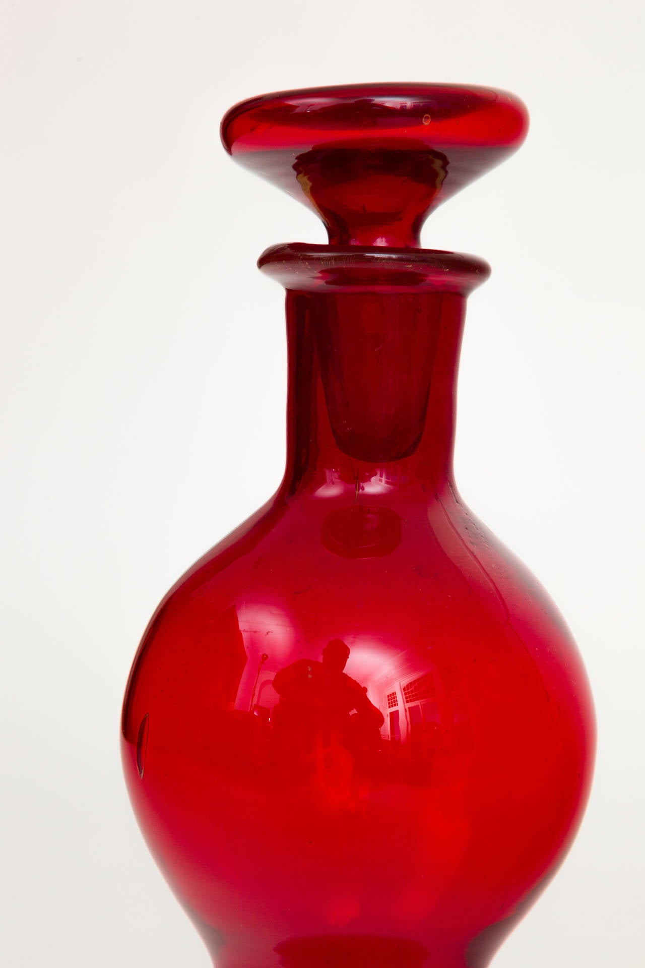 Rare red glass Blenko decanter bottle with blown glass disc stopper, USA, circa 1958.