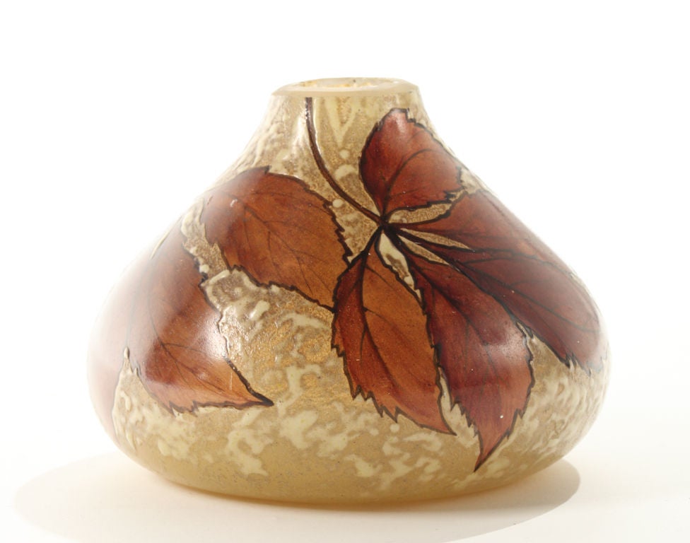 French Art Nouveau glass vase with gracefully etched and enamelled leaf pattern  by renowned glass artist Auguste Legras.
.Engraved signature on side, Legras.
 