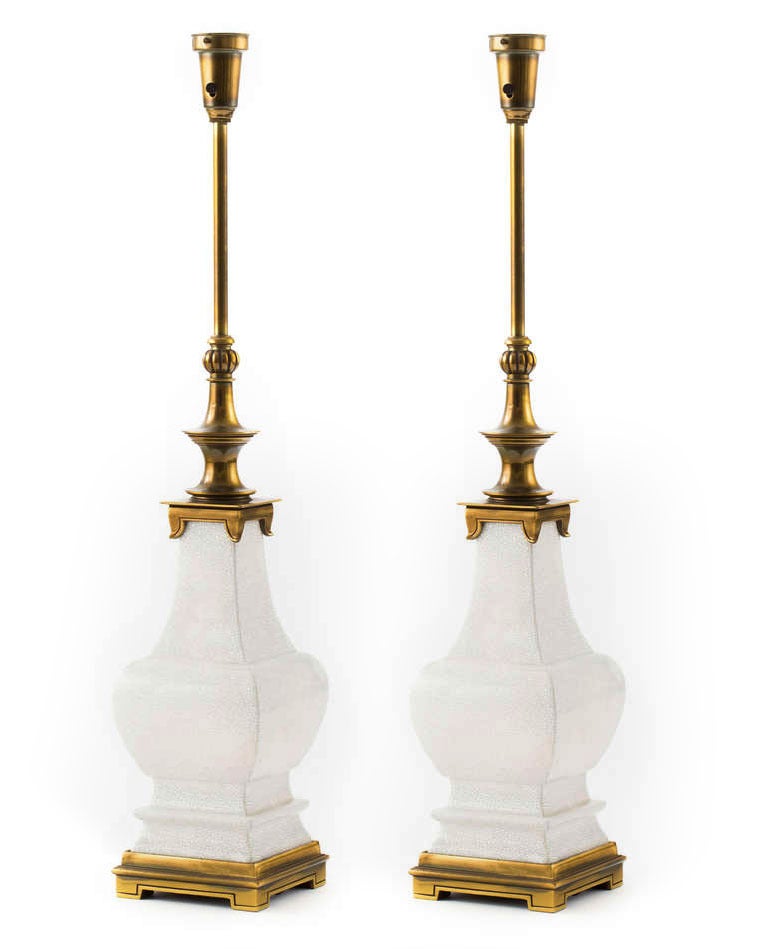 Pair of large scale white craquelure ceramic lamps with brass base and hardware. The Stiffel Lamp Company, circa 1960's.
Measures 37.5 height, lamp body measure 24