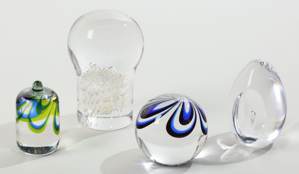 A beautiful collection of Kosta Boda handblown glass paperweights signed by artists Ann and Goran Warff. These were created in the late 1960s.
Largest clear glass paperweight measures 4.5