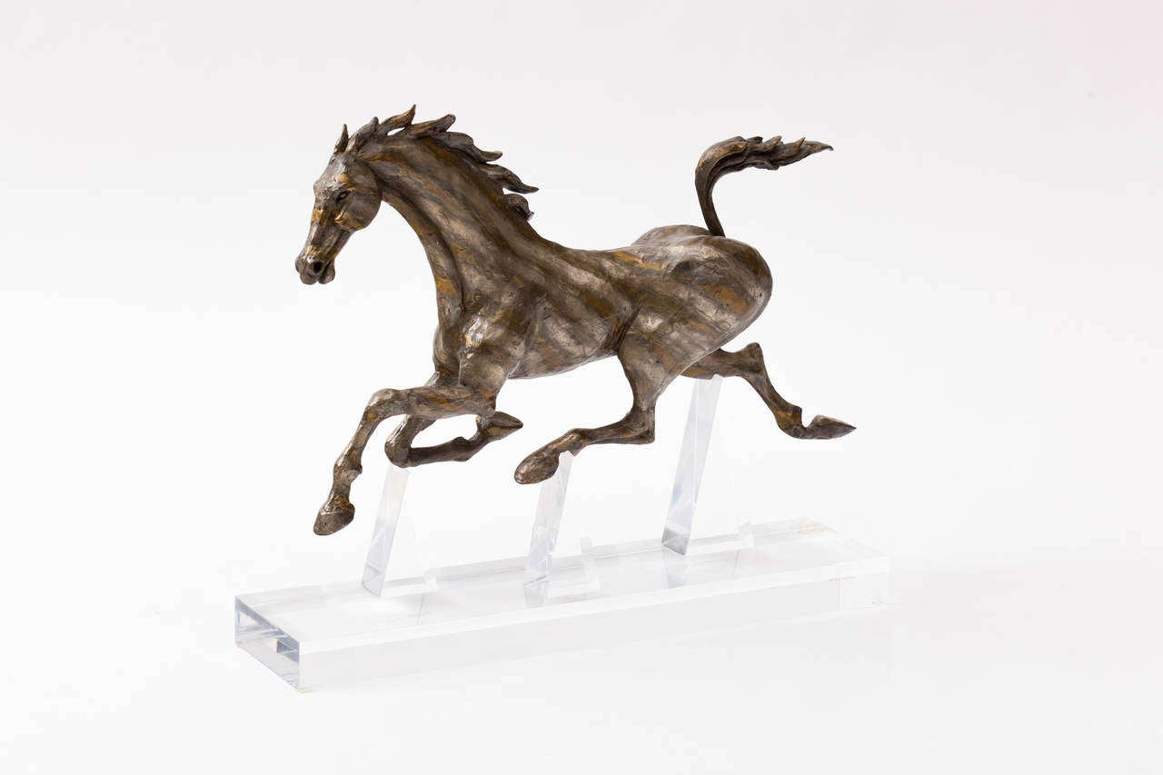 Gorgeous bronze running horse sculpture by California artist David Huenergardt.
