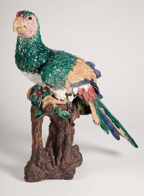 Very rare pair of large Chinese ceramic parrots, last quarter 19th century. Each polychrome painted bird perched atop a realistically rendered trunk with foliage. Repairs to tails & feathers.

The most prominent among the antique Chinese parrots