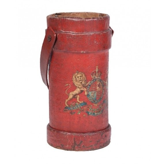 English painted leather cordite (ammunition) carrier, circa 1890. With leather handle and centrally emblazoned with the English Royal Coat of Arms; converted into an umbrella stand.