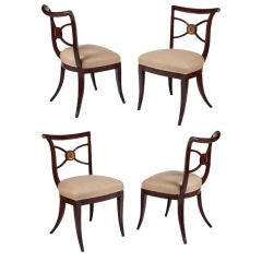 Set of four Italian painted & parcel gilt klismos side chairs