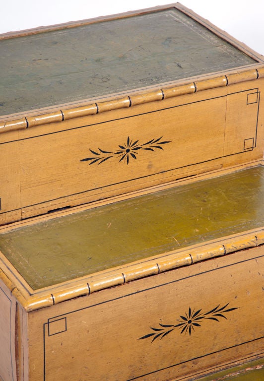 English late Regency painted bed steps, circa 1820-30. With three leather-inset treads, the top step fitted to the side with a drawer (formerly enclosing a bidet) and the second drawer sliding forward (to a former chamber pot compartment).

Though