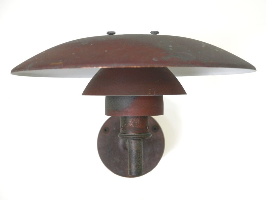 Poul Henningsen design copper wall light, model 4,5 /3, manufactured by Louis Poulsen.

 “Form is given in a perfect mastery of the material.” 
 - Poul Henningsen

In just ten words, Poul Henningsen summarizes his theory of lighting design. He