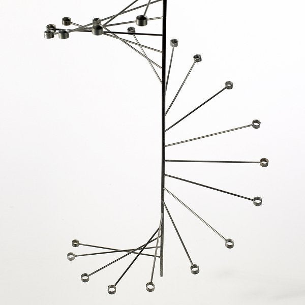 Designed by Poul Kjaerholm in 1956, this rare sculptural candelabra was produced by E. Kold Christensen from 1959 through 1966, then for a brief time in 1974. Manufactured in only small numbers, the PK 101 is extremly rare. Taking his inspiration by