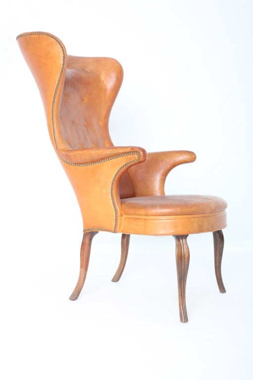 It was love at first sight… the unforgettable silhouette, the gorgeous leather aged perfectly, highlighting the rich patina…We knew immediately that we had to have it in our collection, the High Wingback chair is considered to be Frits Henningsen's