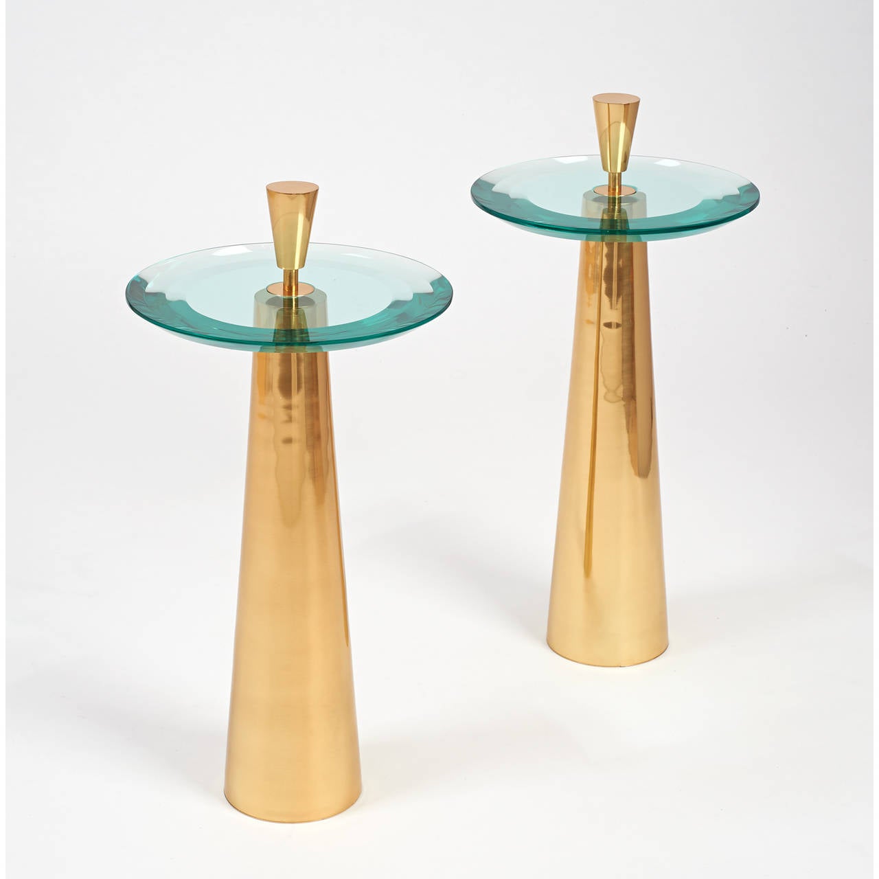 Roberto Rida (b. 1943).

A sculptural pair of side tables.
Triple beveled glass, polished tapered bronze base.
Signed,
Italy, 2014.

Limited edition, exclusive to L'Art de Vivre.

Measures: 13.5 Ø x 23 H at glass.

Two pair available.
