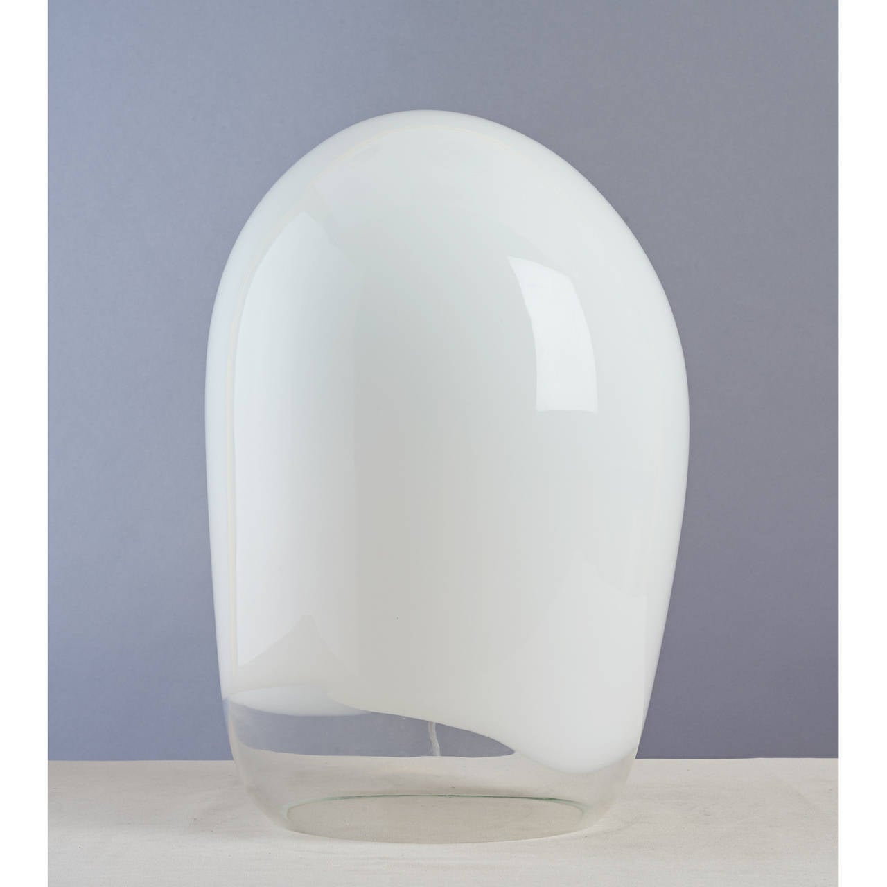 Vistosi.
Blown glass table lamp.
White and clear glass.
Italy, 1970s.
Signed.
Dimensions: 17 H x 13 D x 11 W.
Rewired for use in the U.S.