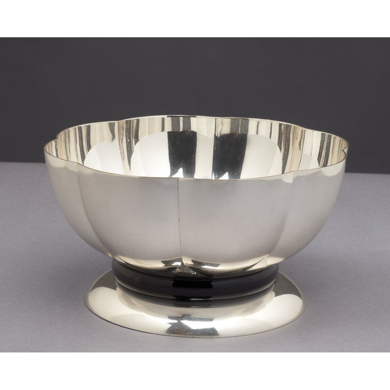 Gallia
Silvered bowl with mahogany mount.
Signed on underside.
France, 1930s
Dimensions: 7 diameter x 4 H.