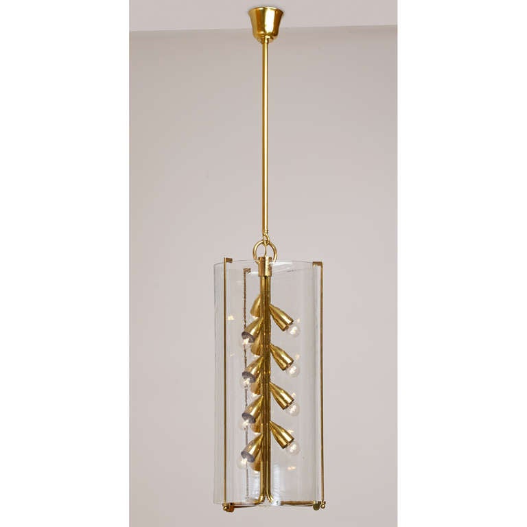 Italy, 1960s.
 
An elegant thirteen-light lantern.
With a large blown glass shade supported by polished bronze mounts.
 
Measures: 14 Ø x 29 / 57 H.

Rewired for use in the U.S.A.