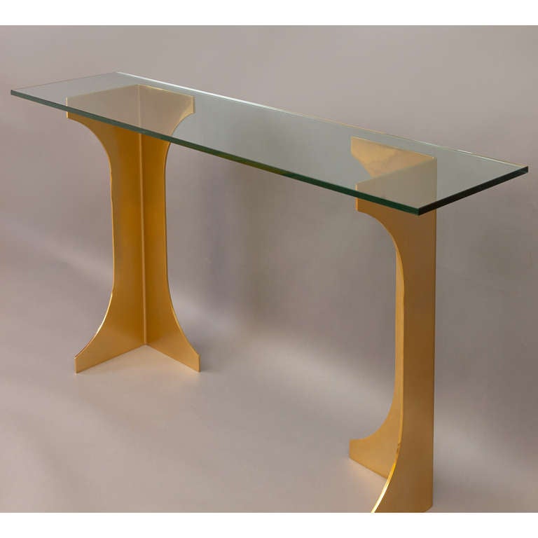France, 1970s.

A bronzed steel console table
with two pedestal bases (with variable configurations).
Existing glass top may be replaced with glass or stone top sized to need.
The bases: 11 x 11 x 31.5 H, shown with top 63 x 16.