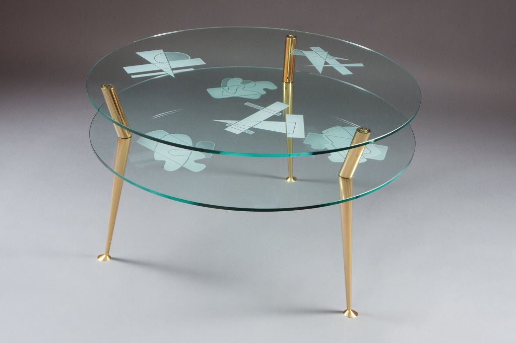 ROBERTO RIDA, 2010
Two tiered glass table with engraved geometric motifs, raised on bronze legs