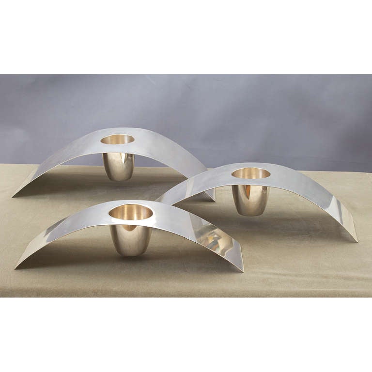 Lino Sabattini (b. 1925)
A set of three silver plated abstract forms in graduated size.
Can be used as candlesticks or for flowers.
Signed
Italy, 1960s

Measures: Large: 18 x 7 x 4 H
Small: 15 x 5 x 3 H.