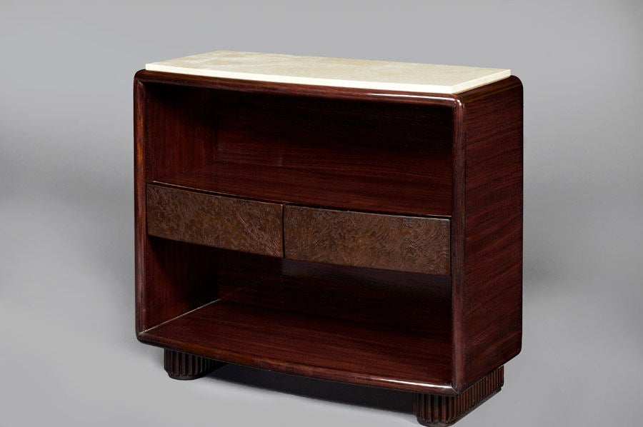 Pair of bowed front bedside tables in polished wood, 
with contrasting drawers in sandblasted stained oak and reeded feet; 
inset stone tops,
Italy, 1930s
Measures: 27.5 x 12 x 24 H.
   