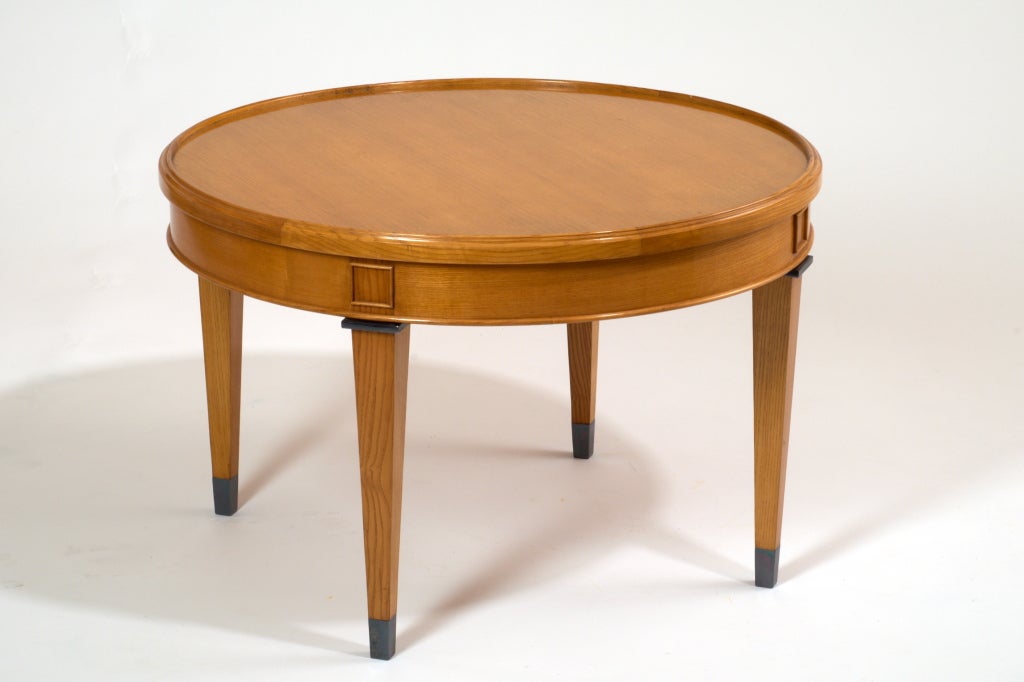 France, 1950s
Striking neoclassical table in blond ash,
The circular top beautifully set in wood frame
Patinated bronze mounts and sabots.
Dimensions: 27.5 diameter x 18 H.