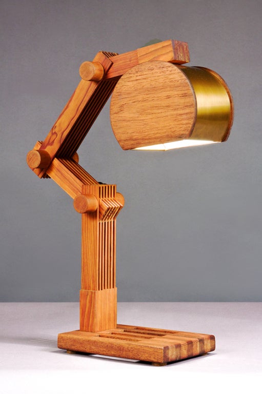 A striking adjustable desk lamp, handcrafted in wood lattice with brass covered shade.<br />
<br />
Rewired for use in the U.S.