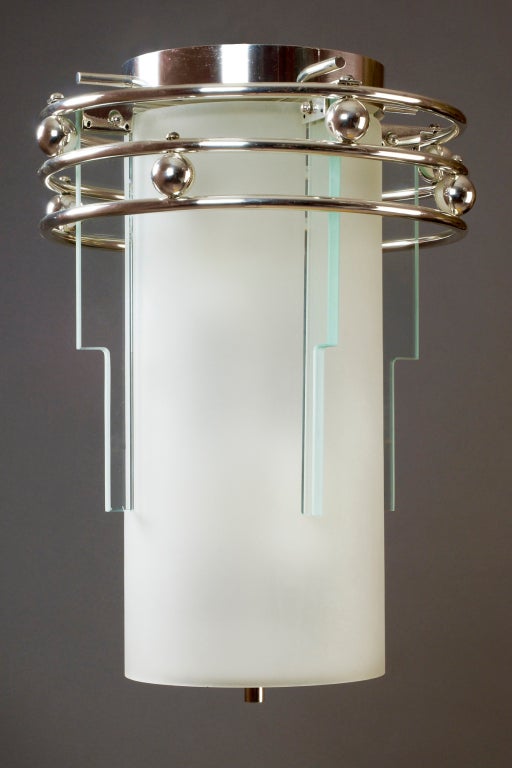 France, 1930s
A frosted and clear glass lantern, with silvered bronze mounts
Rewired for use in the U.S. with four standard bulbs inside.
May be ceiling mounted, or mounted on chain or shaft.
Dimensions: 15 D x 20 H.

 