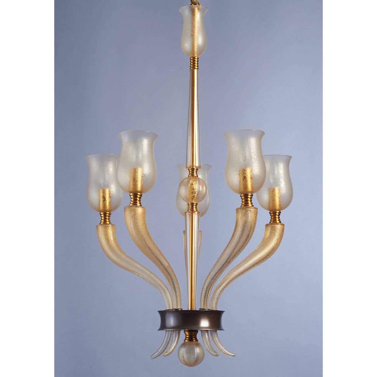 Veronese
Exceptional gold leaf flecked, acid washed blown Murano glass five-branch chandelier by Veronese. Bronze mounts,
Italy, circa 1950.
Dimensions: 34 H x 20 D.
Rewired for use in the USA