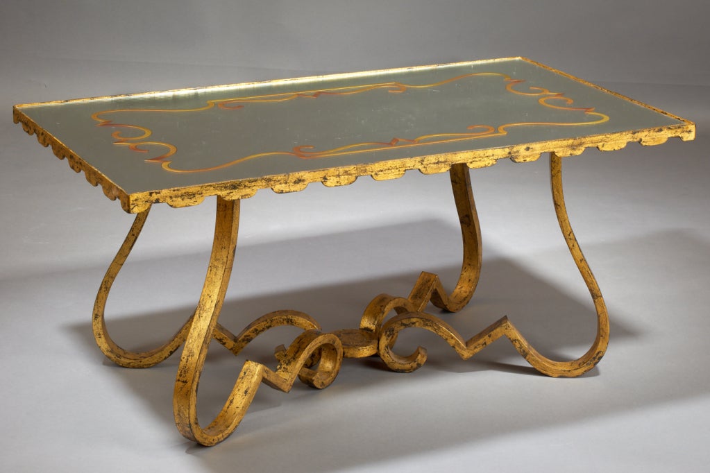 France, 1940's

Baroque gilt wrought iron coffee table, with engraved verre eglomise mirrored top.