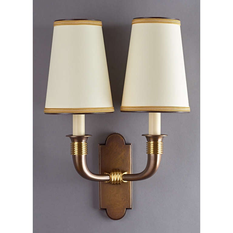 Dominique,
Andre Domin (1883-1962) and Marcel Genevriere (1885-1967).

A rare and exquisite pair of oxidized and polished bronze sconces.
France, 1940s.

Ref: see Marcilhac, p. 303 for this model.

12.5 W x 6 D x 17.5 H.

Rewired for use