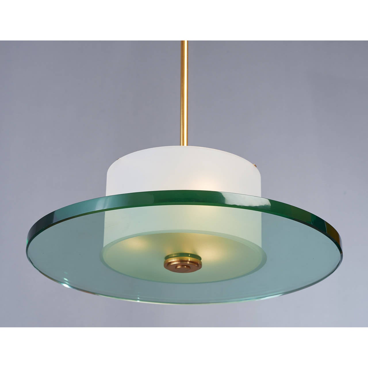 France, 1950s.
Modernist chandelier.
Beautiful glass circular base with frosted center, frosted glass drum, bronze mounts.

Measures: 19 diameter x 33 H.

Rewired for use in the USA with three standard base bulbs.
