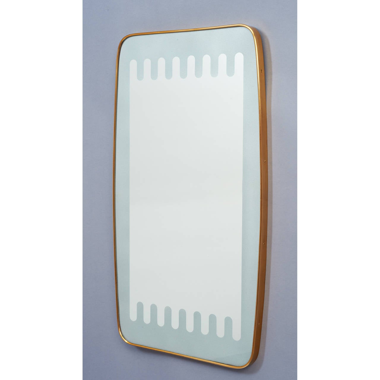 Italy, 1950s

Mirror with frosted wave motif
Brass frame with gently bowed sides

38 x 21.5