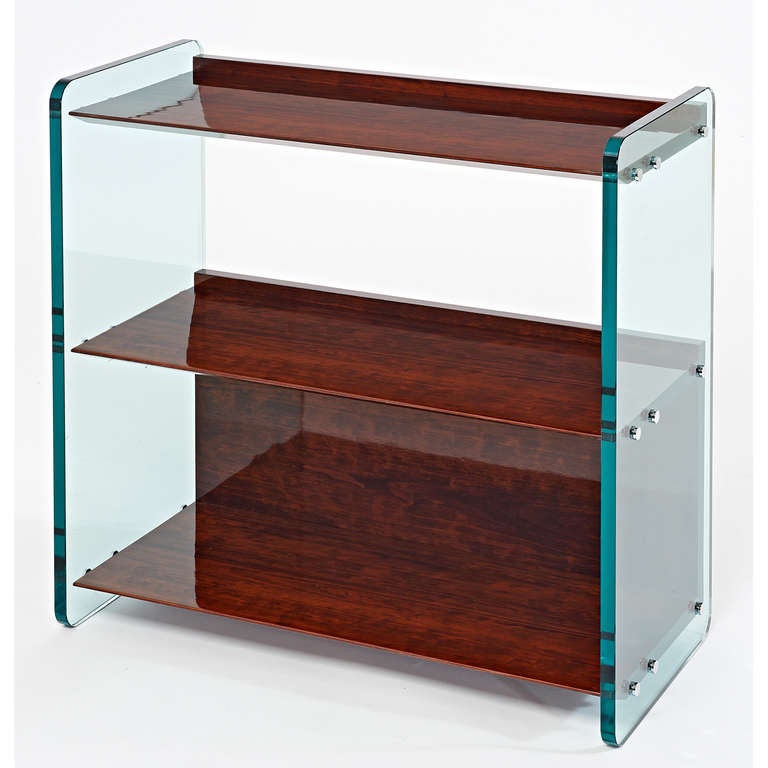 France, 1970s.
A large side table or bookshelf with thick glass slab sides and tapered wood shelves, nickeled mounts.
Finished back, can be used floating.
Dimensions: 30 W x 14 D x 29.5 H.