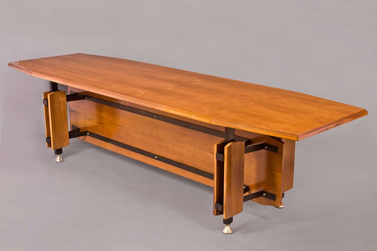 Italy, 1950s.
A magnificent 10 foot tapering dining table in fruitwood with blackened and polished bronze mounts.
Can be used as a conference table.
Dimensions: 118 x 37 x 31 H.