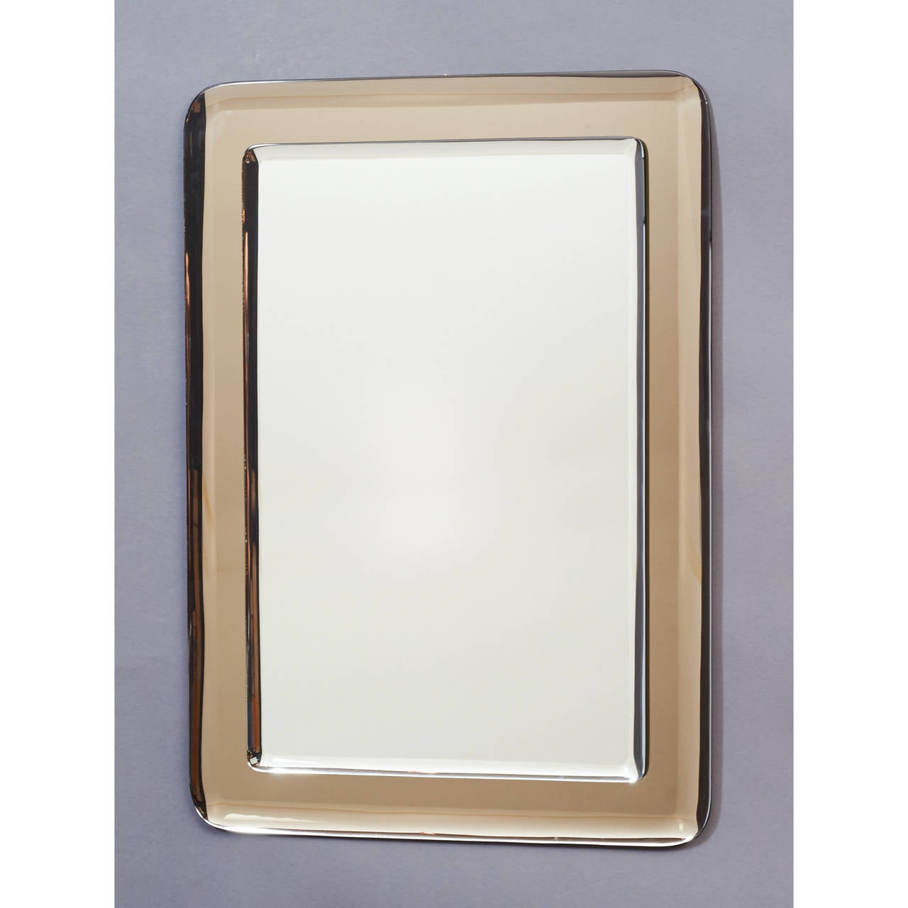 ITALY, 1970's

Reverse beveled mirror mounted on reverse beveled colored smoked mirrored glass,with rounded corners.

19.5 x 28