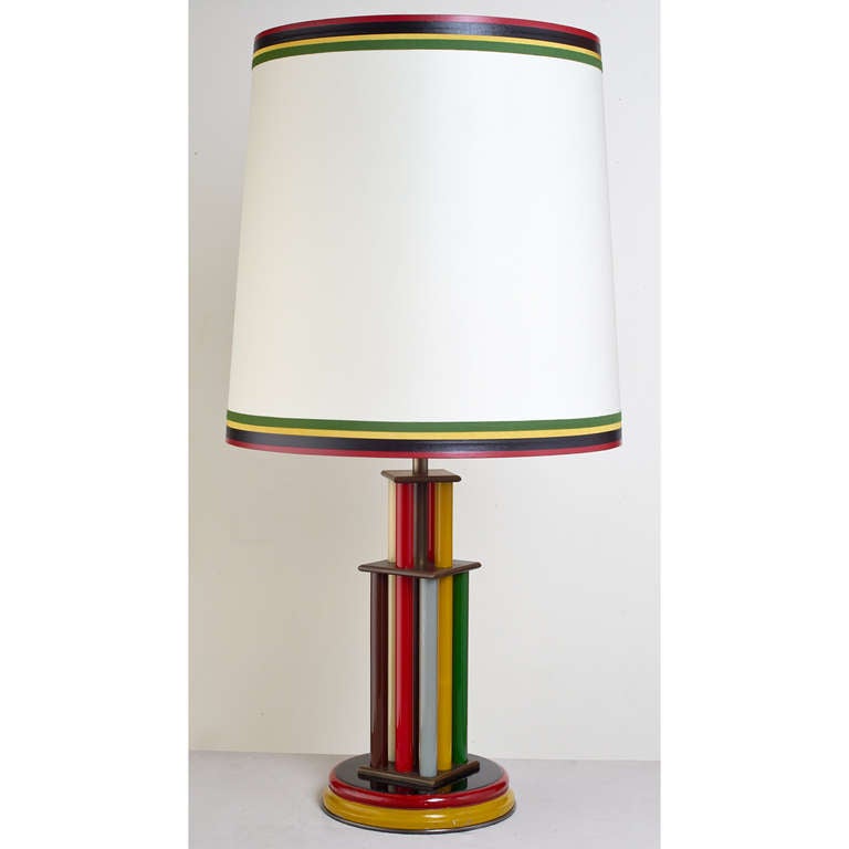 Italy, 1930s
An exceptional table lamp, painted glass tubes, copper mounts and painted wood base.
Dimensions: 13 Ø x 27 H
Rewired for use in the US with one standard base bulb
