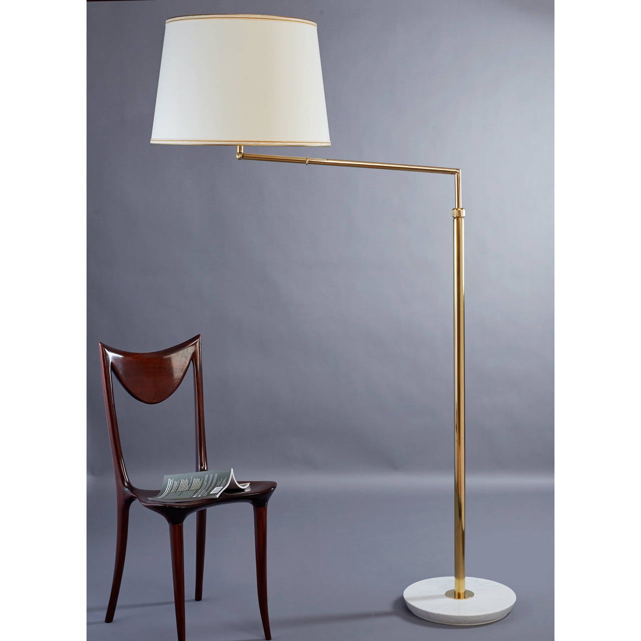 Oluce, Italy, 1940s floor lamp
A polished brass articulated and extending floor lamp on reverse beveled marble base, converts from a standing lamp to a reading lamp and back again, Italy, 1940s.
Dimensions: 75 H x 21 diameter; when in reading
