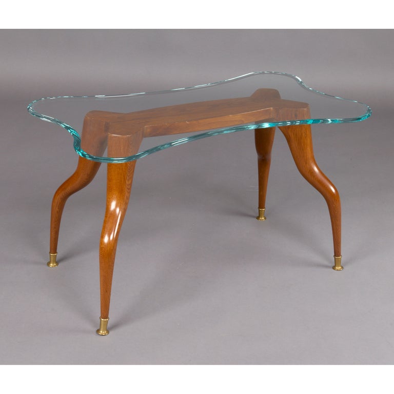 Italy, 1970's

Zoomorphic table with gazelle legs,
carved oak, bronze sabots,
glass top with rounded bevel.

34 x 20 x 19 H