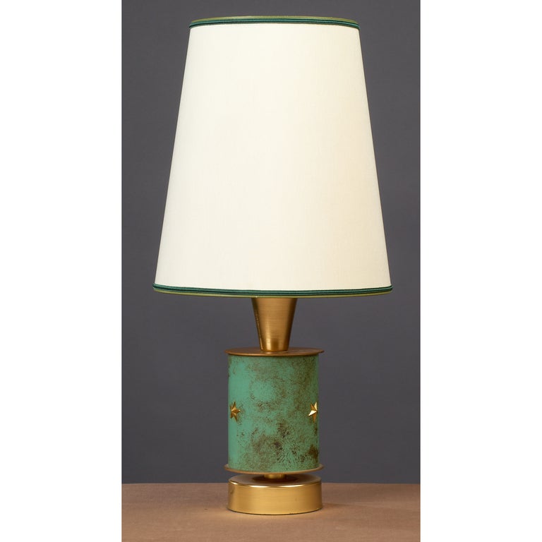 France, 1950s
A single  table lamp in verdigris patinated brass with star motif decor.
Dimensions: 21 H x 9 Diameter
Rewired for use in the US.
