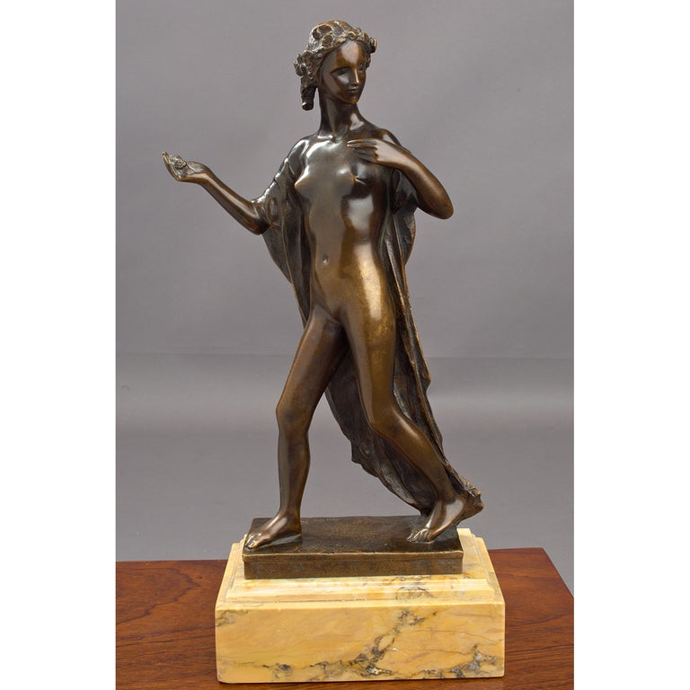 Victor Rousseau (Belgian, 1865-1954).
Patinated bronze of draped striding Primavera figure, her hair adorned with a wreath of flowers. Raised on a stepped marble base.
Signed and dated on base, 1928.

Measures: 15.5 H x 7 x 4.5.