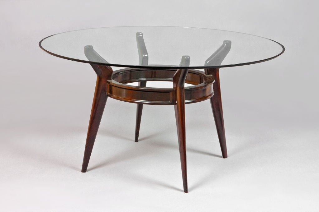 Mahogany stained wood table in the style of Ico Parisi with beveled glass top.
Italy, 1950s
Measure: 55 Ø x 29 H.