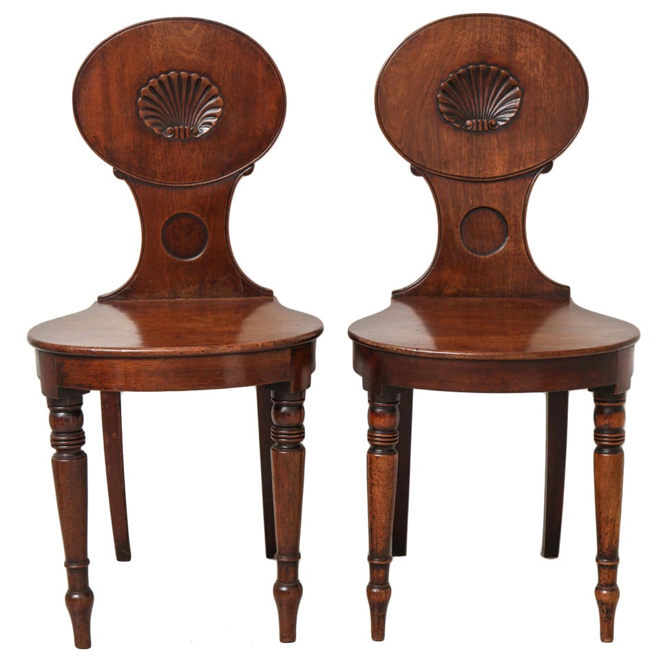 A Pair of English Regency Mahogany Hall Chairs