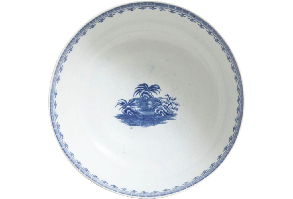 A late 18th century Worcester blue and white bowl with landscape scenes and a decorated interior rim and bottom