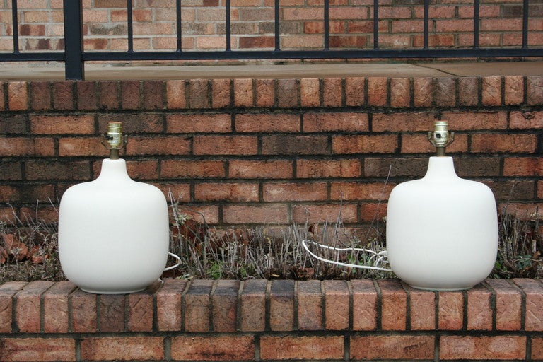 A beautiful pair of white glazed ceramic lamps.