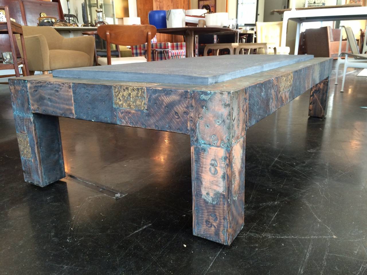 An incredibly well executed large cocktail or coffee table designed and produced by the Paul Evans Studio and retailed by Directional, circa 1969. Patchwork consists of individual plates of steel, bronze, copper and pewter. Table retains its