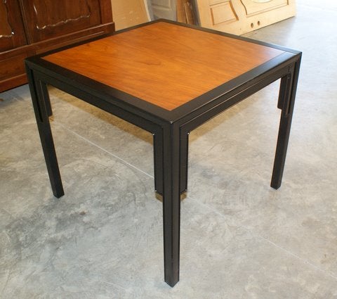 A wonderful petite dining table with a teak inlay and a two part matte lacquer ebony finish - Designed by Michael Taylor for Baker as part of their 