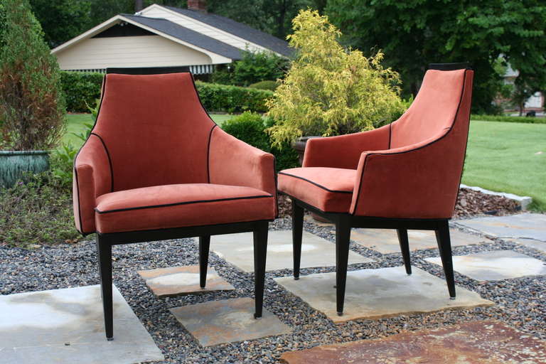 A very nice and elegant pair of armchairs, attributed to Harvey Probber. Sculptural back and arms with wood detail throughout. Tapered black lacquered legs are very nice. The chairs sit very well.