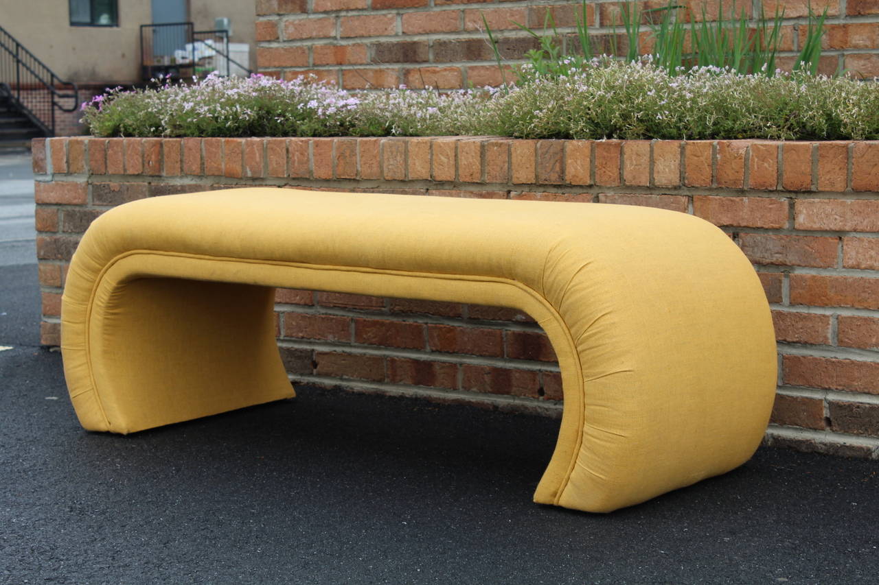 1970s upholstered bench seat in the manner of Milo Baughman. Sturdy and comfortable, this bench looks great and would work well at the end of a bed.