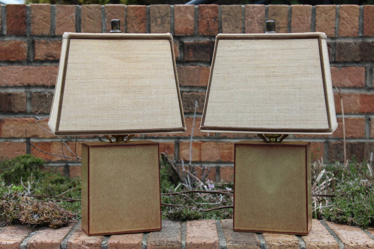 Beautiful pair of ceramic table lamps by Turner, circa 1970s. Nice earth tones throughout, these lamps are quite small, measuring 5.25