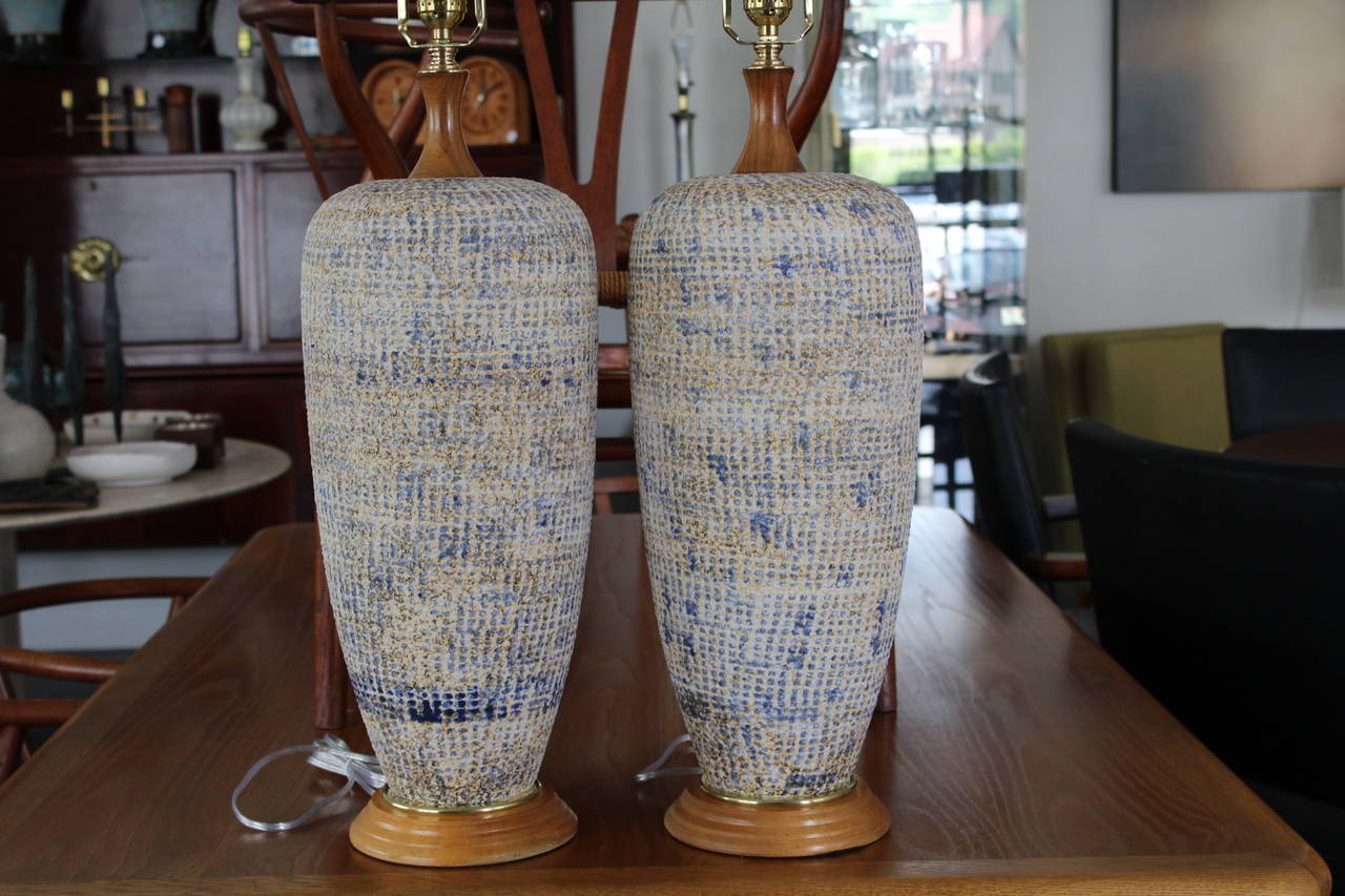 Cute pair of table lamps with soft earthy/organic tones and a nice texture. The browns, yellows and blues work really well together. Completely restored, ready to go. 
25.5