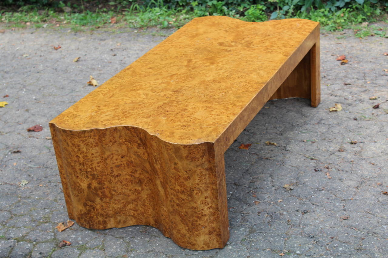 A handsome and stately Italian burl cocktail table, 1970s. The burl veneer is bright and detailed and incredibly well done. Notice the detail on each end of the table. Quite an exquisite piece.