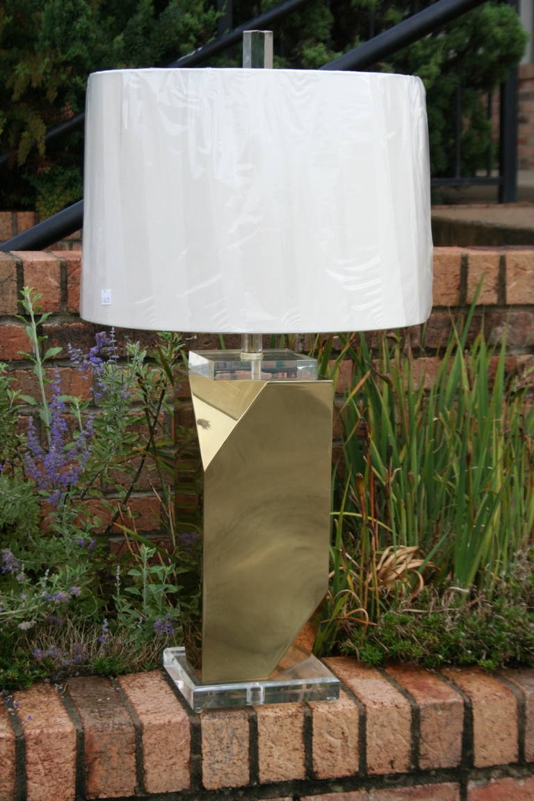 A unique, folded brass and acrylic table lamp, in the manner of Curtis Jere. A great statement piece. Acrylic finial tops off this piece. Shade available. Base diameter 7