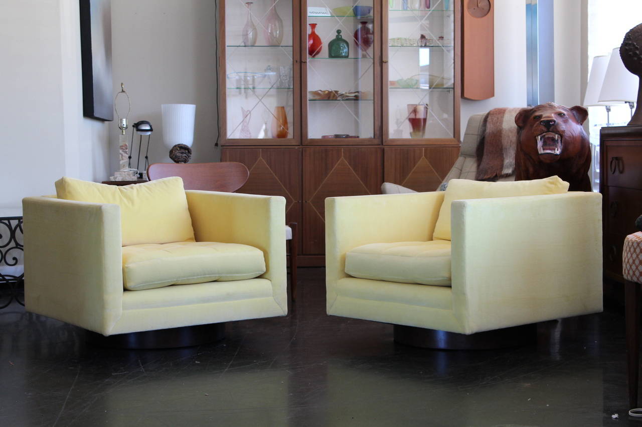 Pair of swivel cube/club chairs by Harvey Probber. Walnut swivel base, wonderful look and scale to this pair.